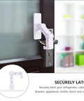 Childproof Door Handle Lock For Cabinets And Doors, white plastic safety lock installed on a door, easy no drill install, home safety