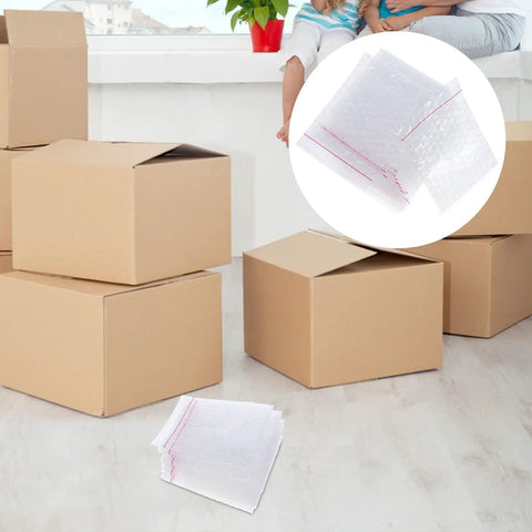 Fifty Pack Small Bubble Mailers 10x10 Plus 3cm Self Seal Padded Envelopes with cardboard boxes in background