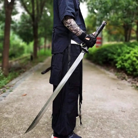 Person holding Hand Forged Longquan Style Dao Sword With High Carbon Steel Blade Full Tang And Dope Matte Black Wooden Scabbard