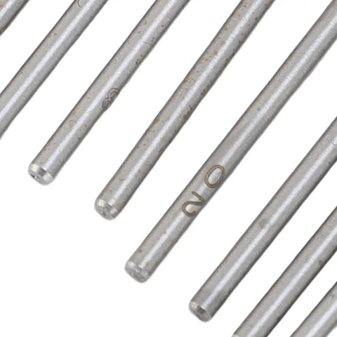Close-up of steel components from 36 Hole Watchmakers Tap And Die Set Stainless Steel Micro Tool Kit for precise threads repair.