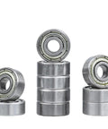 Set of 2 router bit bearing kit top mounted bearings with three sixteenths inch inner and three eighths inch outer diameter on display