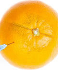 1Ml Luer Lock Syringe Set With 23G 1 Inch 25mm Needle used on orange, showing application for industrial liquid dispensing.