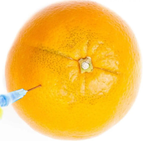 1Ml Luer Lock Syringe Set With 23G 1 Inch 25mm Needle used on orange, showing application for industrial liquid dispensing.