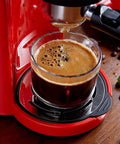 Close-up of 5Bar Espresso Machine With Milk Frother For Office Use making rich espresso in a glass cup with Italian-style grinding.