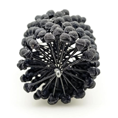 Front view of a 3-inch ball hone brush with black silicon carbide abrasive spheres