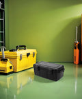 Black Portable Waterproof Tool Organizer Box With Hard Carrying Case and Secure Lock on green floor
