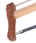 Close-up of rugged teakwood frame saw handle with manganese steel blade for effortless wood cutting.