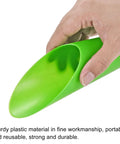 Hand holding a durable plastic scoop from Green Garden Shovel Tool Set For Planting And Transplanting Tiny Plants And Succulents Digging Scoops Kit