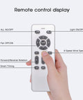 Hand holding remote for Caged Ceiling Fan With Lights For Farmhouse Vibe, Low Profile Flush Mount With Remote Control Indoor 6 Speed Rattan Blades