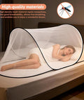 Large Pop Up Mosquito Tent For Adults set up on bed, showing breathable mesh and compact design for single-person use.