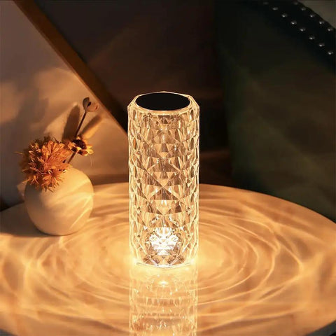 Lit Crystal Diamond Portable Table Lamp With 3 Color Touch Control on table, emits warm glow, acrylic material, LED night light.