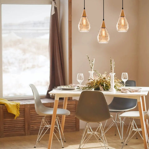 Three Pack Teardrop Glass Pendant Lights with Adjustable Nylon Core Cables Contemporary Ceiling Fixtures for Kitchen Island Dining Room and Work Area Bulb Not Included over dining table.