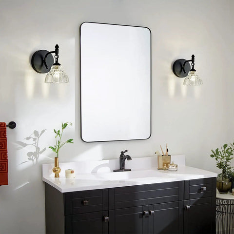 Matte Brass Vintage Vanity Light Fixture With Flower Shaped Glass Shades Over Mirror Five Light Wall Sconce in bathroom