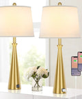 Two Dope Gold Table Lamps With USB Ports And Rotary Switch, 26 Inch Tall Brass Nightstand Lamps With White Fabric Shade in a room
