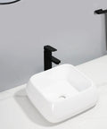 USZWBY Vessel Sinks Modern Minimalist Creative Sink Home Art Above Counter Basin Balcony Bathroom Ceramic Wash Bathroom Bowl Sink with black faucet in modern bathroom setting.