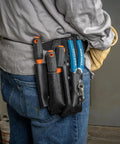 Electrician with Insulated Screwdriver Set With 1000V Rating, 4 Inch Round Shanks, Square Tip, Phillips, And Slotted Tips in tool belt