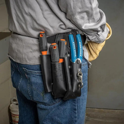 Electrician with Insulated Screwdriver Set With 1000V Rating, 4 Inch Round Shanks, Square Tip, Phillips, And Slotted Tips in tool belt