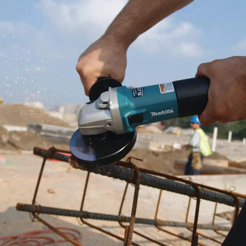 Workhorse High-Power 4 1/2 Inch Angle Grinder With SJS Mechanical Clutch cutting metal rebar on construction site