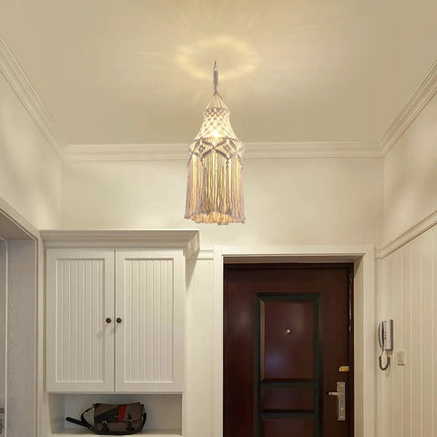 Boho Macrame Pendant Light With Plug In Cord And On Off Switch hanging in hallway, warm light illuminating ceiling