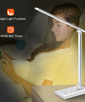 Dope All In One LED Desk Lamp With 15W Fast Wireless Charging And USB Port next to a person reading, showing night light function.