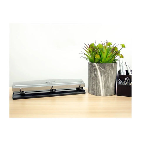 Rock Solid 3 Hole Punch For Office And Home Use With 12 Sheet Capacity, Metal Construction, Rubber Base, Sleek Silver Finish on desk