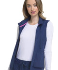Woman wearing navy Zip Front Scrub Vest With Detachable Hood For Women, Stretch Fabric, Flattering Fit, Princess Seams, Plenty Of Pockets