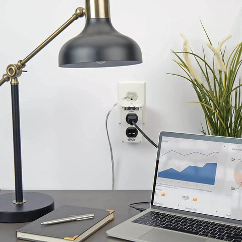 Office setting with ISOBLOK2-0 Heavy Duty Outlet Extender With 2 Outlets Direct Plug In Wall Power Strip Surge Protector in use.