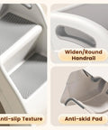Foldable Toddler Step Stool For Bathroom Sink, Rock Solid Non Slip Footrest With Secure Handles, Bpa Free Thick Plastic showing anti-slip texture and round handrail.