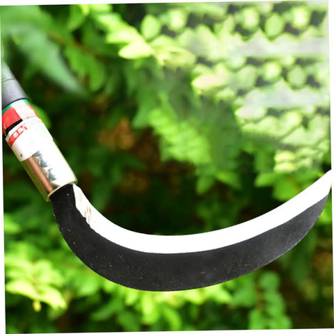 Close-up of a Two Pack Manganese Steel Weeding Sickle Garden Tool Set blade against green foliage.