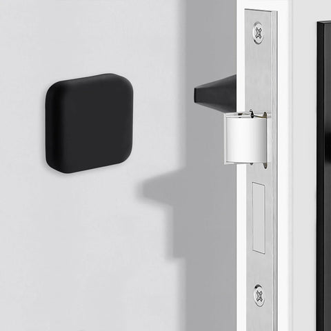 Black silicone door stopper wall protector installed in room; Protect walls and furniture from dents and scratches with a silicone door stopper wall protector.
