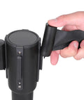 Hand retracting belt on Premium Pro-Grade Crowd Control Stanchions With 6.5 Ft Retractable Belt, Easy Assembly, Sturdy Black 2-Pack.