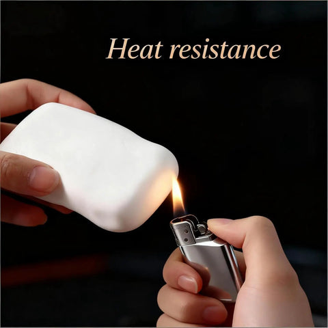 No Sweat Mastic Flex 26 PCS White Waterproof Sealant Clay For Patching Wall Holes Plugging AC Vents And Drainage Pipes Easy Indoor Outdoor Putty Fix With Total Crackdown On Drafts And Water Leaks Every Time, shown being tested for heat resistance.