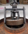 Inner Hole Bearing Puller with Three Claw Design in action removing a bearing from an engine component