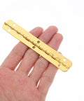 Pro Grade Heavy Duty 8 Pack Golden Iron Piano Hinges For Jewelry Boxes And Storage Cabinets showcased in hand