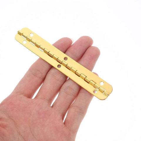 Pro Grade Heavy Duty 8 Pack Golden Iron Piano Hinges For Jewelry Boxes And Storage Cabinets showcased in hand