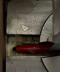Heavy Duty 3 Ton Ratchet Arbor Press Featuring Rapid Ram Action And Counterweighted Handle with red pen and metal work surface.