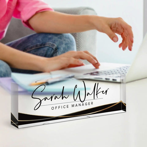 Person using laptop with Personalized Acrylic Desk Name Plate With Custom Text For Your Name Or Title, Sleek Black Stripe Office Decor