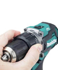 Hand gripping the 40V Max Xgt Compact Brushless Cordless 1/2 Drive Impact Wrench with adjustable torque settings.