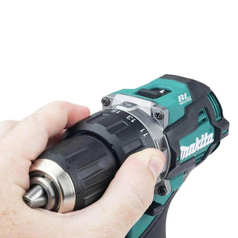 Hand gripping the 40V Max Xgt Compact Brushless Cordless 1/2 Drive Impact Wrench with adjustable torque settings.