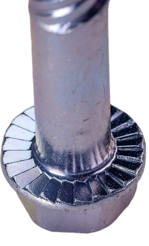 Close-up of serrated hex washer head on LDC385 3 Eighths By 5 Inches Zinc Plated Large Diameter Concrete Screw for masonry use.