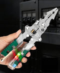 Person holding All In One 18 In 1 Foldable Wire Stripper With Voltage Detector, shown with green grips and multifunctional tool features.