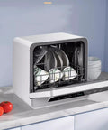 Compact Countertop Dishwasher Automatic Auto Dry Portable Mini Kitchen Essentials For Rv Dorm Apartment Large Capacity Veggie Washer No Sweat Quick Scrub Slick Design Daily Cooking Game Changer with dishes in the front.
