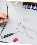 Stainless Steel Eyeglasses Frame Bending Pliers Pro Grade Gear Optical Repair Tool for Quick And Precise Glasses Fixing on table