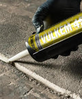 Pro Grade Polyurethane Sealant For Concrete Brick And Stone Heavy Duty Horizontal Formula applied in expansion joint on concrete surface.