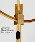Close-up of gold and brass adjustable rings and dimmer switch of Eclipse Dope Bright Modern LED Torchiere Floor Lamp with Built In Touch Dimmer.