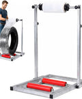 Heavy Duty Film Wrap Roll Dispenser For Tires And Trucks Adjustable Manual Stretch Wrapping Stand with a tire and wrap.
