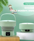 Portable 6L Mini Washing Machine With Foldable Design And Drain Valve for apartments and travel, shown in green, resting on a table.