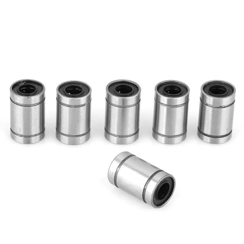 Eight Piece Linear Ball Bearings LM6UU 6MM Double Sealed Linear Motion Bushings For 3D Printer And CNC Rigs displayed in a row with one tilted.