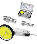 Front view of a dial test indicator kit with yellow dial, steel probes and adapters in a metal case