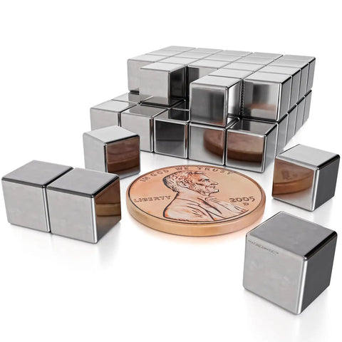 Super Badass N48 Neodymium Cube Magnets 1/4 Inch 6Mm size with a penny for scale on a white background.